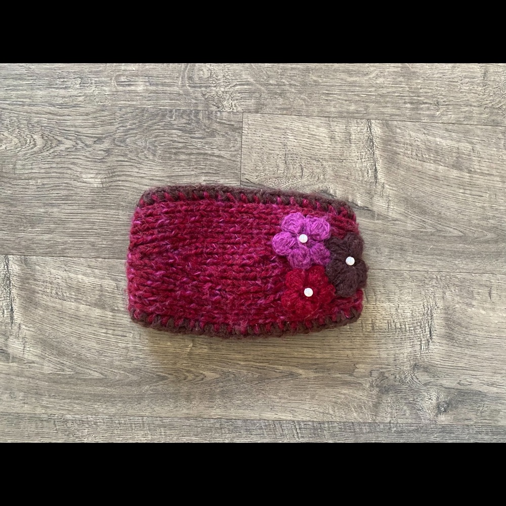 Like New Knit headband in maroon with flower details.